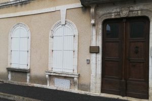 The closed shutters of Dr. Foulquier's office (DR)