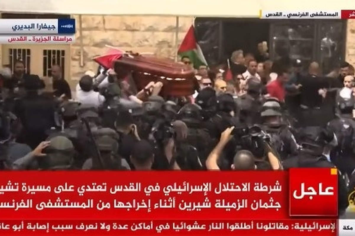 Israeli police charge at funeral of Palestinian journalist