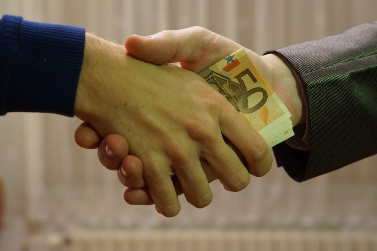 (hands_shaking_with_euro_bank_notes_inside_handshake_-_royalty_free,_without_copyright,_public_domain_photo_image_01